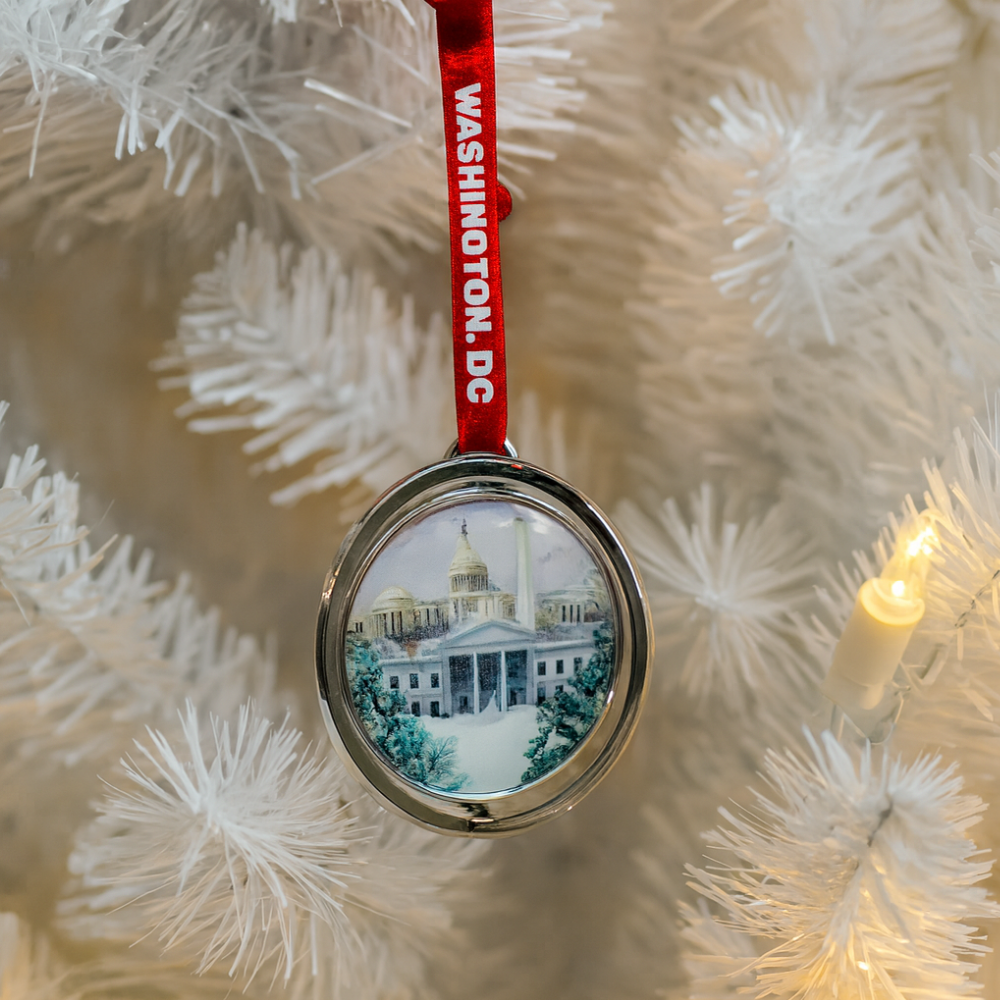 Exclusive Spinning Silver Ornament – Washington, D.C. Landmarks Collage with Snow Scene & Red Ribbon